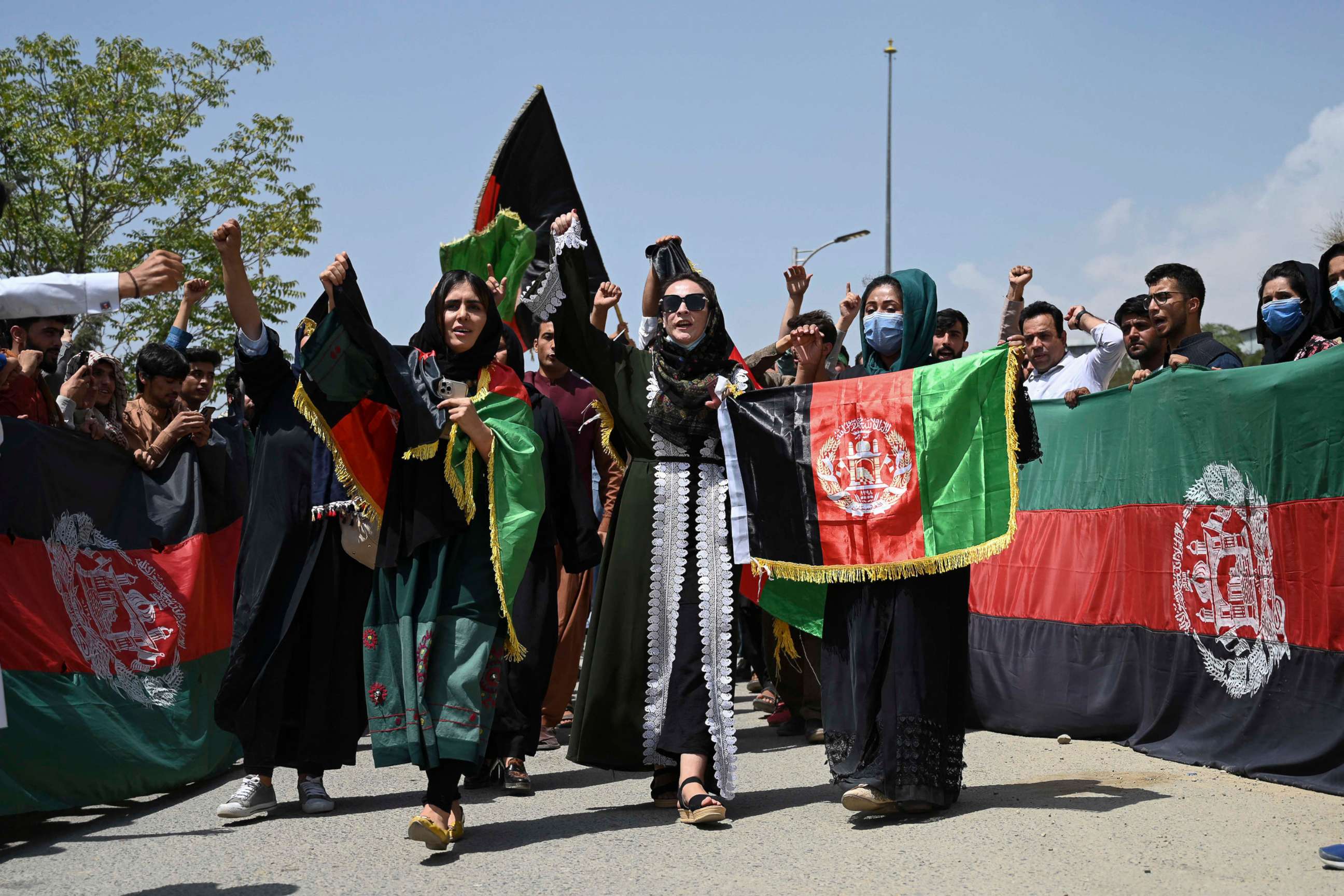 PHOTO: Afghans celebrate Independence Day with the national flag in streets of Kabul, Afghanistan, Aug. 19, 2021.