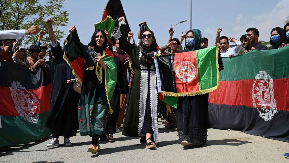 PHOTO: Afghans celebrate Independence Day with the national flag in streets of Kabul, Afghanistan, Aug. 19, 2021.