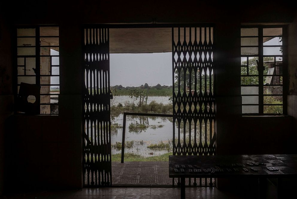 PHOTO: Rising floodwaters approach the doorstep of a testing and isolation ward for suspected COVID-19 patients, during the coronavirus disease (COVID-19) outbreak, at the primary health centre in Ismailpur, Bhagalpur, Bihar, India, July 28, 2020.