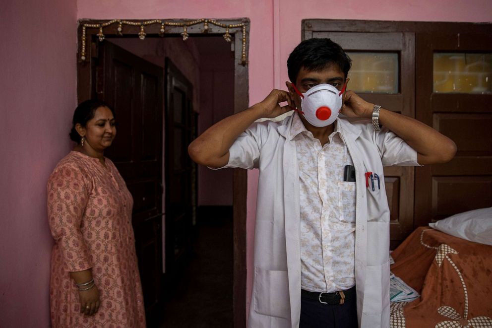 PHOTO: Dr. Kumar Gaurav, 42, a medical professor and consultant psychiatrist who has been named the top official at Jawahar Lal Nehru Medical College and Hospital as his wife Dr. Mili Jaswal, looks on, in Bhagalpur, Bihar, India, July 27, 2020. 