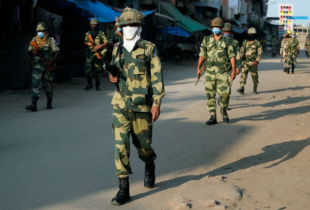 PHOTO:Indian paramilitary soldiers patrol a street during lockdown in Ahmedabad, India, April 15, 2020. 