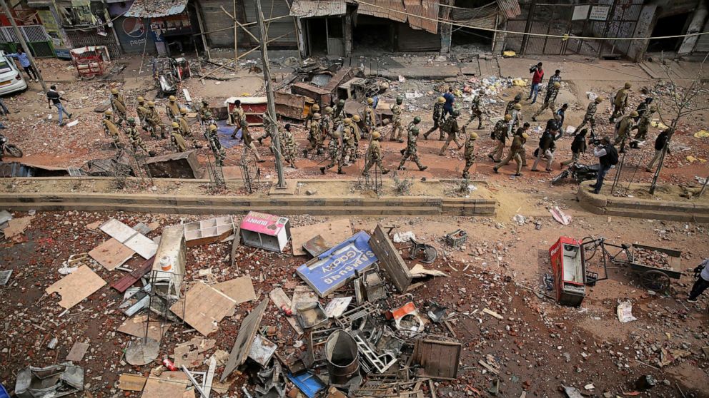 PHOTO: Indian paramilitary soldiers patrol a vandalized street in New Delhi, India, Feb. 27, 2020. 