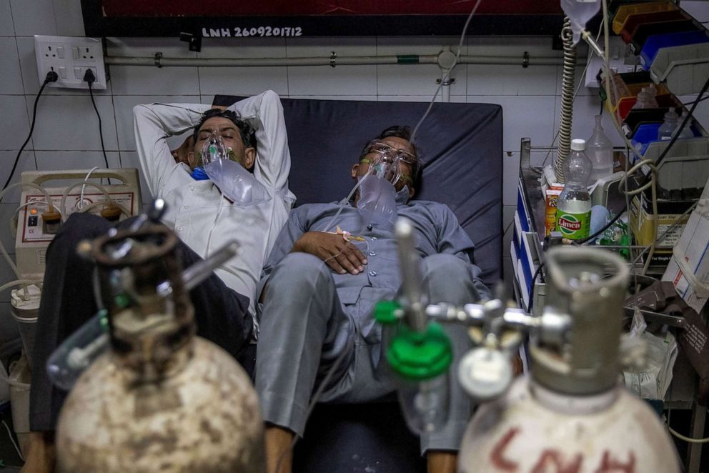 PHOTO: Patients suffering from COVID-19 get treatment in the casualty ward in Lok Nayak Jai Prakash Hospital in New Delhi, India on April 15, 2021.