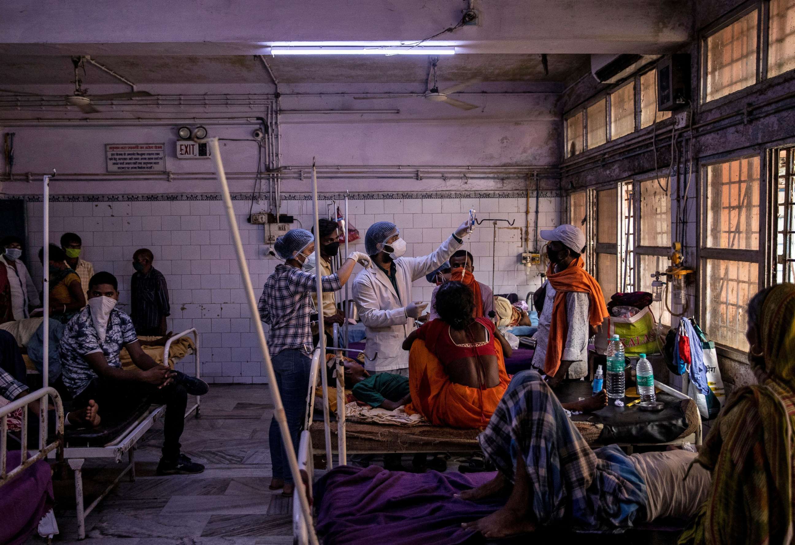 PHOTO: Medical staff treat a patient inside the emergency ward of Jawahar Lal Nehru Medical College and Hospital during the coronavirus pandemic in Bhagalpur, Bihar, India, July 27, 2020.