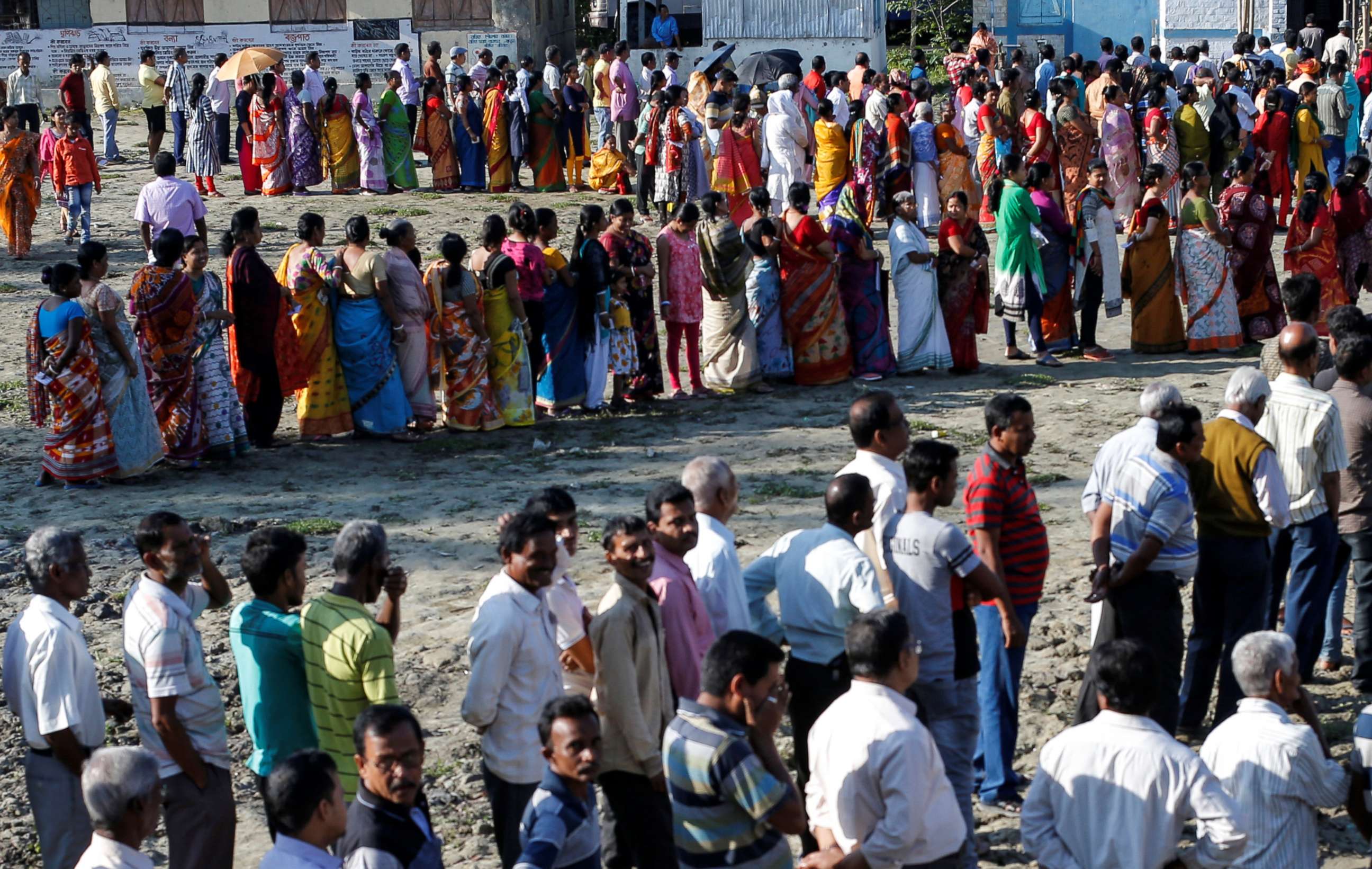 PHOTO: Voters line up to cast their votes outside a polling station during the first phase of general election in Alipurduar district in the eastern state of West Bengal, India, April 11, 2019.