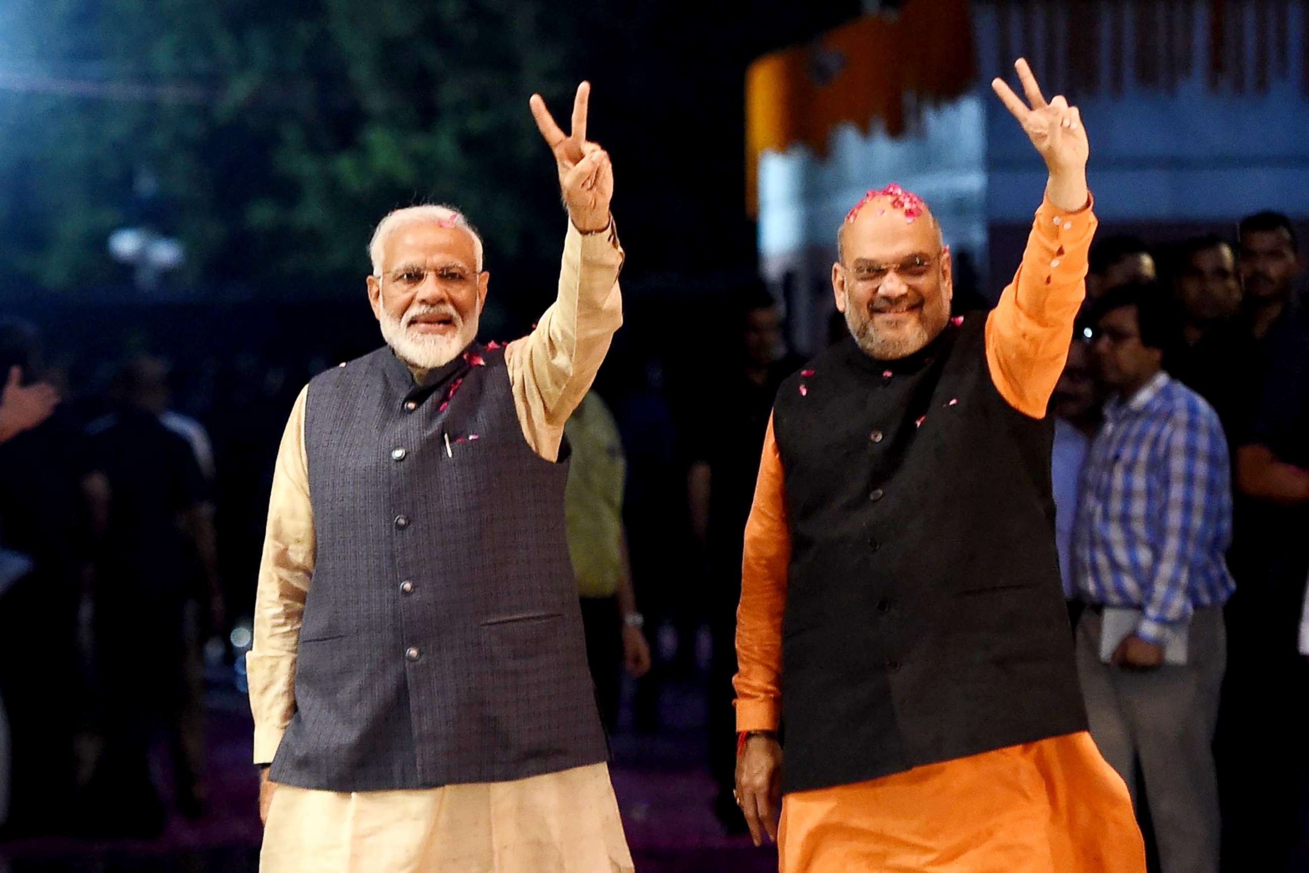 PHOTO: Indian Prime Minister Narendra Modi (left) and president of the ruling Bharatiya Janata Party (BJP) Amit Shah gesture as they celebrate the victory in India's general elections, in New Delhi on May 23, 2019.