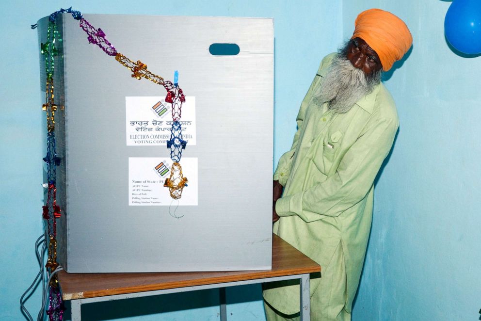 PHOTO: An Indian voter looks on as he casts his vote at a polling booth in a village on the outskirts of Amritsar on May 19, 2019, during the 7th and final phase of India's general election.