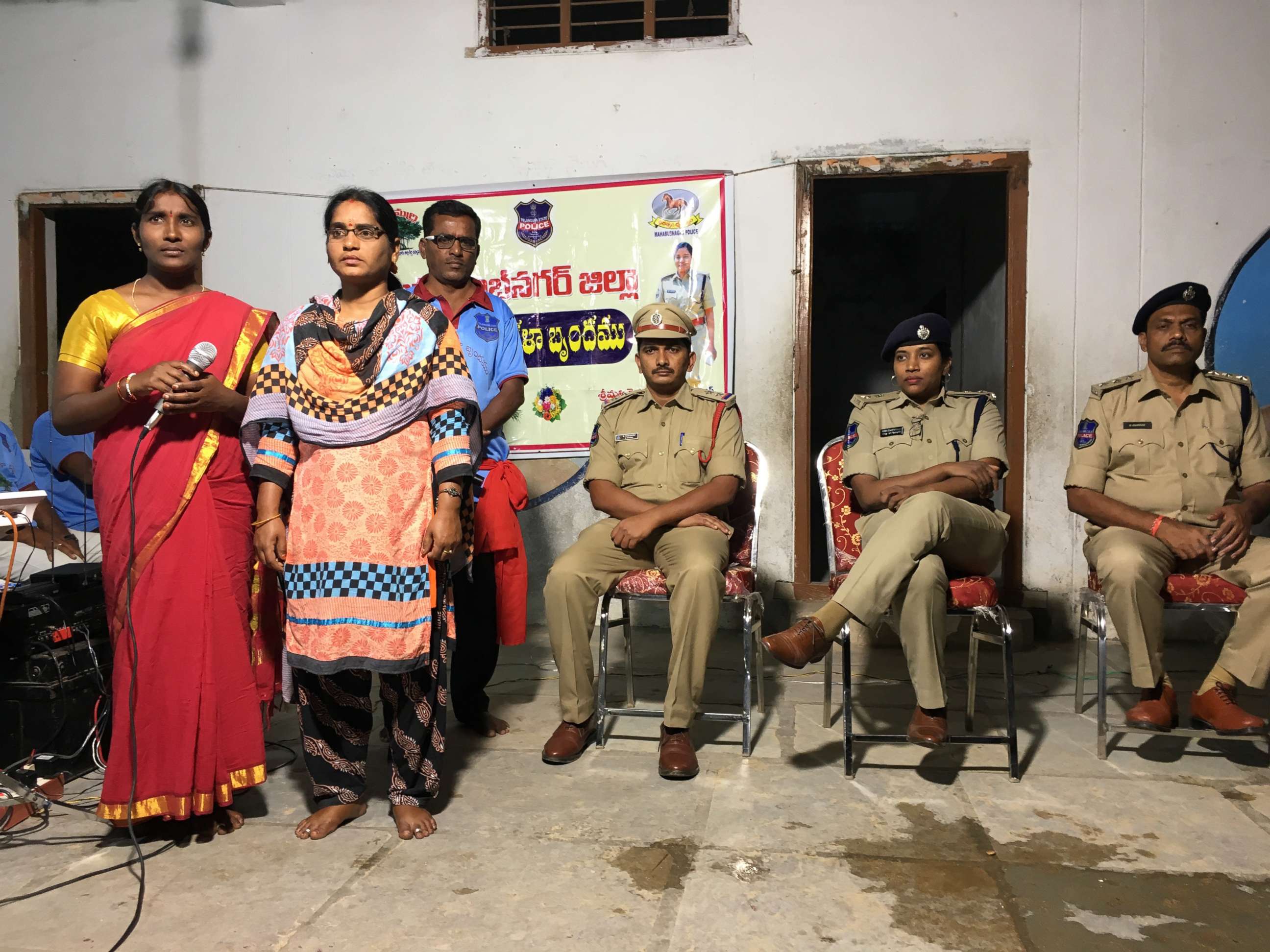 PHOTO: Police superintendent Rema Rajeshwari, with two plainclothes female police officers and other members of a police team, instructs villagers about the dangers of rumors spread via WhatsApp, in Chinnadaripally, India, on Sept. 30, 2018.