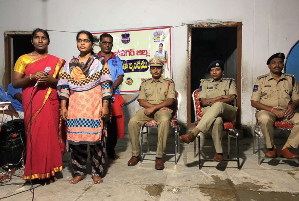 PHOTO: Police superintendent Rema Rajeshwari, with two plainclothes female police officers and other members of a police team, instructs villagers about the dangers of rumors spread via WhatsApp, in Chinnadaripally, India, on Sept. 30, 2018.