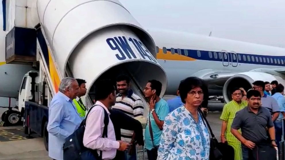PHOTO: Passengers stand on the tarmac after an emergency landing, due to lost cabin pressure, on a Jet Airways flight, in Mumbai, India, Sept. 20, 2018 in this still image obtained from social media video.