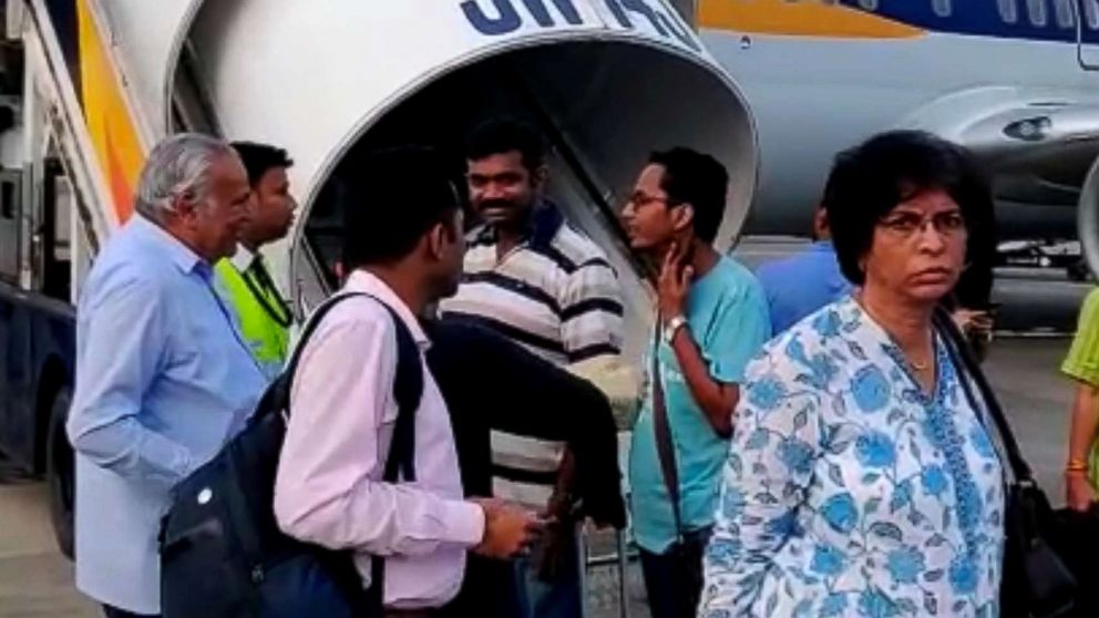 PHOTO: Passengers stand on the tarmac after an emergency landing, due to lost cabin pressure, on a Jet Airways flight, in Mumbai, India, Sept. 20, 2018 in this still image obtained from social media video.