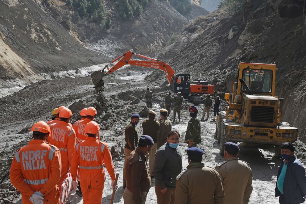 PHOTO: National Disaster Response Force (NDRF) personnel clear debris after a portion of the Nanda Devi glacier snapped off Sunday morning, releasing water trapped behind it in Tapovan, northern state of Uttarakhand, India, Feb. 9, 2021. 