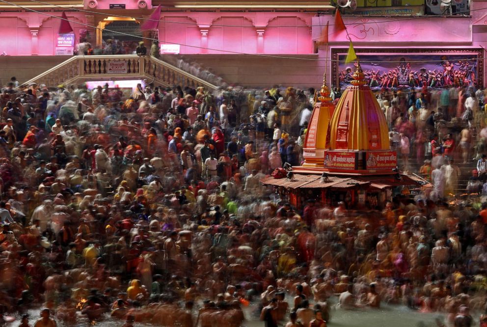 PHOTO: Hindu devotees take a holy dip in the Ganges river during Shahi Snan at "Kumbh Mela", or the Pitcher Festival, amidst the spread of the coronavirus disease, in Haridwar, India, April 14, 2021.