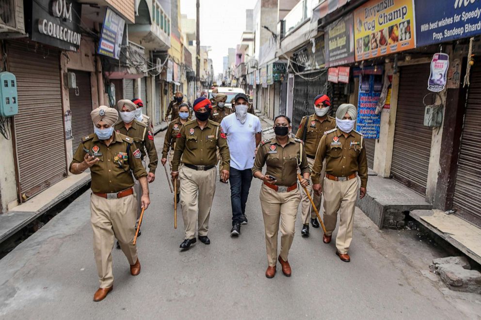 PHOTO: Police patrol a street during a government-imposed lockdown as a preventive measure against the COVID-19 coronavirus, in Amritsar, India, March 24, 2020.