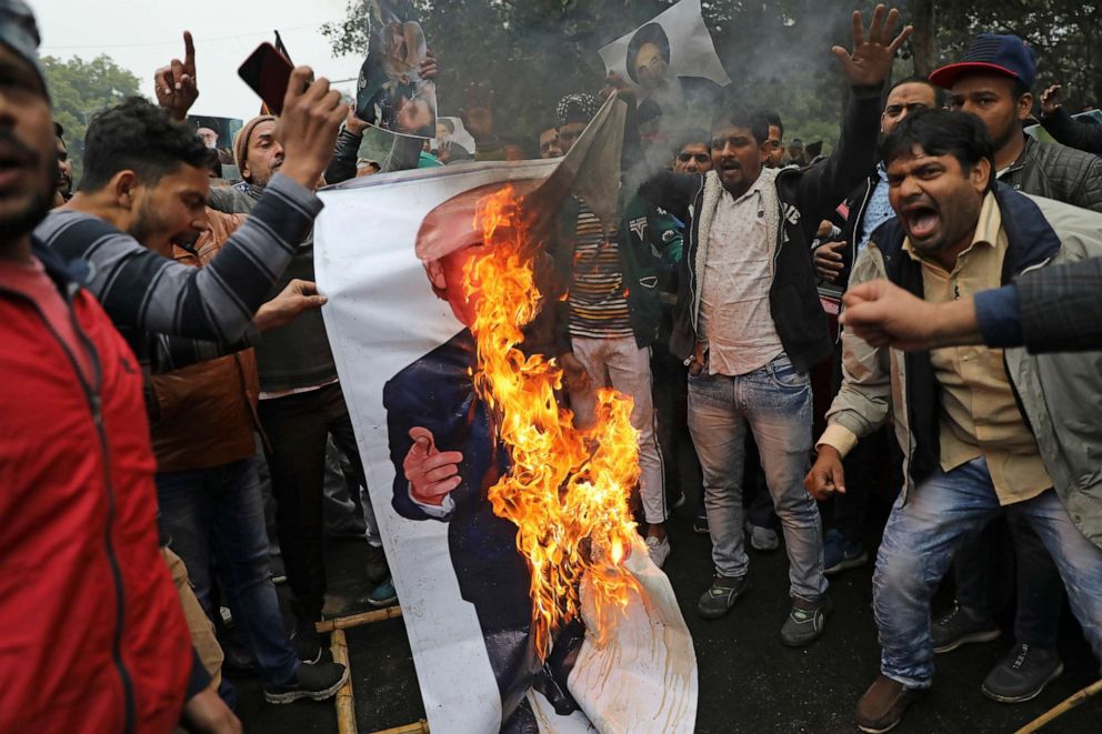 PHOTO: In this photo taken near the U.S. embassy in New Delhi, India, on Jan. 7, 2020, Indian Shiite Muslims burn a banner of U.S. President Donald Trump during a protest against the American drone strike that killed Iranian Maj. Gen. Qassem Soleimani.