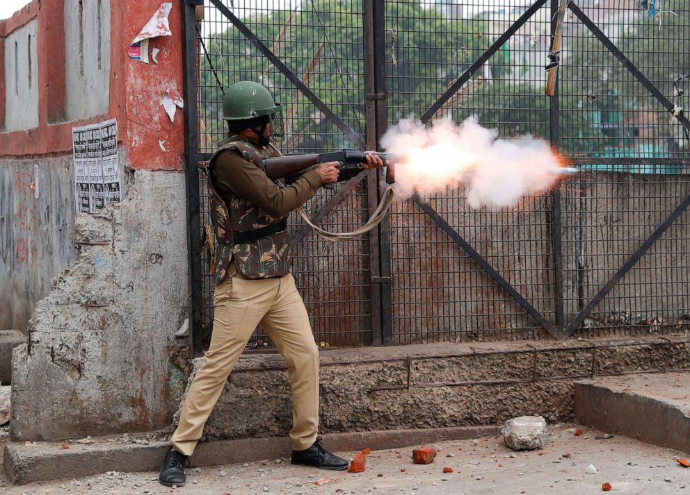 PHOTO: A riot police officer fires tear gas during a protest against a new citizenship law in Seelampur, an area of Delhi, India  Dec. 17, 2019.