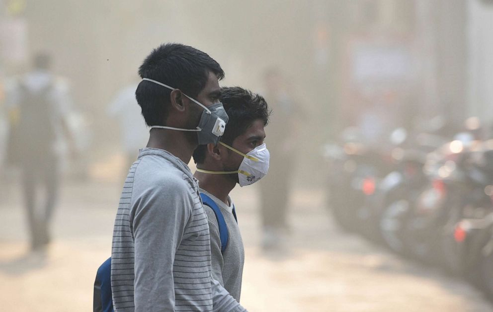PHOTO: People wear pollution masks to protect against air pollution in Dehli, India, Oct. 28, 2019.