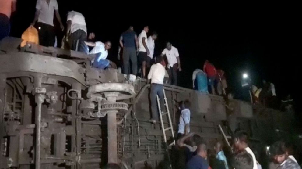PHOTO: People try to escape from toppled compartments, following the deadly collision of two trains, in Balasore, India June 2, 2023.