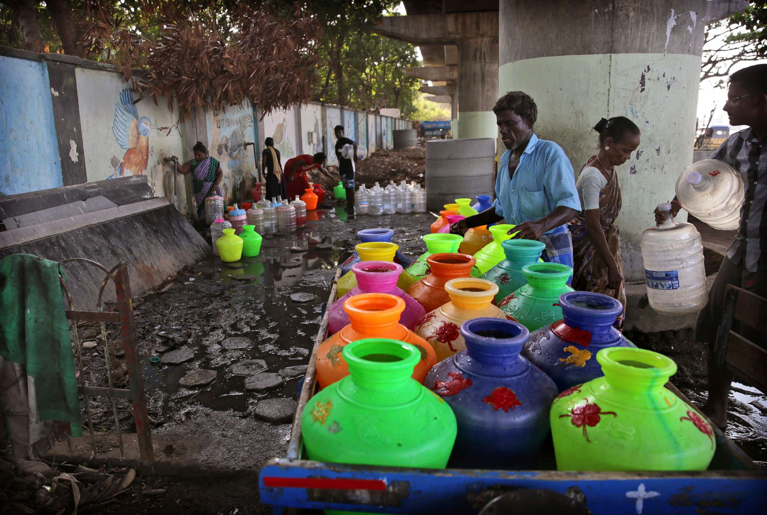 PHOTO: In this Monday, July 15, 2019, photo, Indians fill drinking water at a water filling depot in Chennai, capital of the southern Indian state of Tamil Nadu.