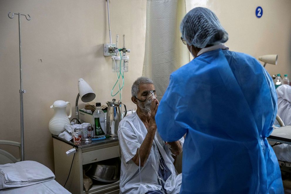 PHOTO: A patient gestures to a colleague of Rohan Aggarwal, 26, a resident doctor treating patients suffering from the coronavirus disease (COVID-19), at Holy Family Hospital in New Delhi, India, May 1, 2021.