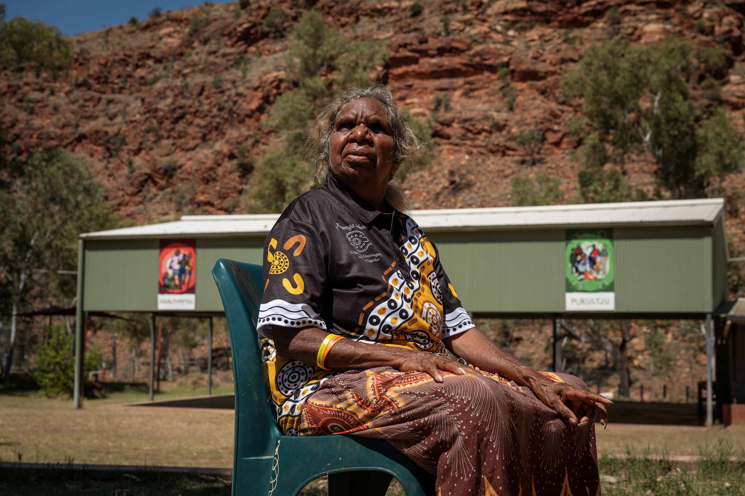 PHOTO: Teacher Tarna Andrews sits in the local school grounds, ahead of a nationwide referendum on Indigenous issues, in Areyonga, Australia, September 15, 2023.