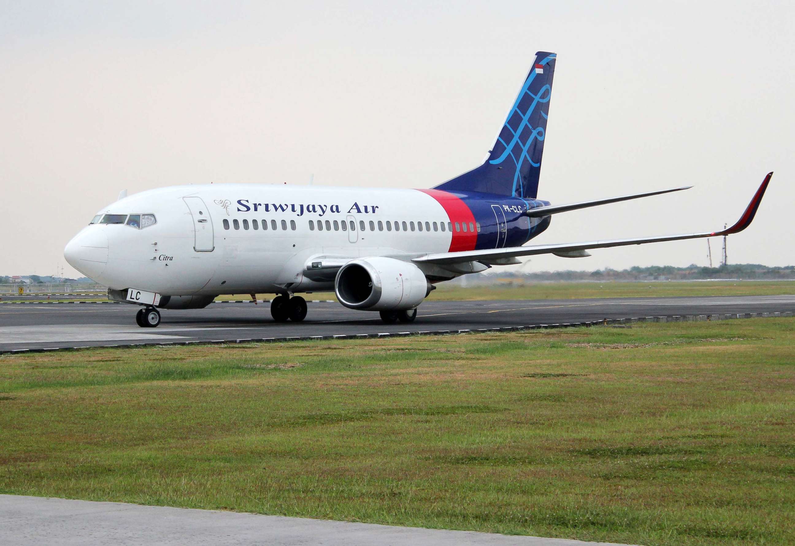 PHOTO:Boeing 737-524 plane, registration PK-CLC, of Sriwijaya Air, sits on the runway at Ahmad Yani International Airport in Semarang, Indonesia, Oct. 6, 2012. 