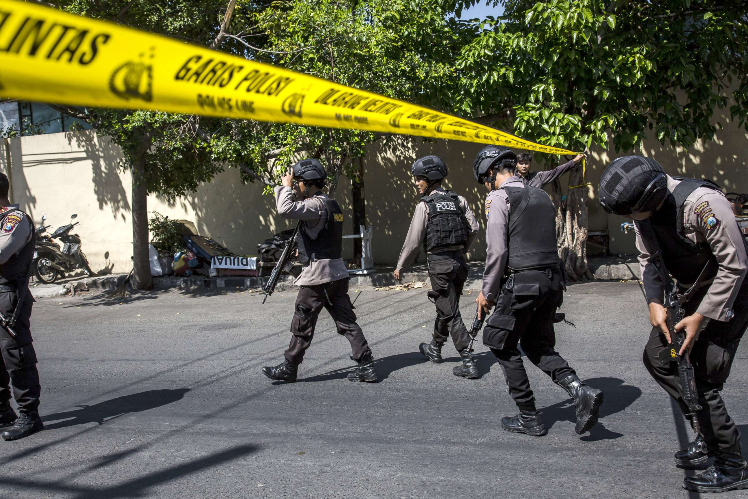PHOTO: Indonesian police stand guard outside the Surabaya police station following another explosion, May 14, 2018, in Surabaya, Indonesia.