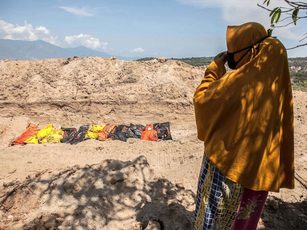 PHOTO: Susanti, stands near a mass burial field where her husband was buried, Oct. 3, 2018, after a earthquake and tsunami hit Palu, Central Sulawesi, Indonesia on Sept. 28.