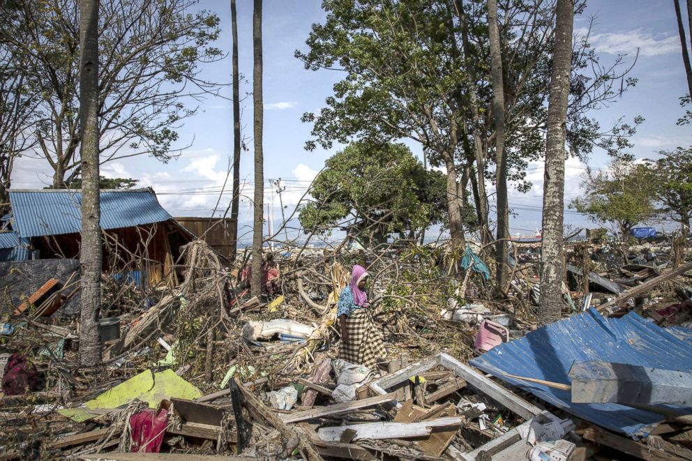 PHOTO: An elderly women, Riba, walks through the rubble and debris of building that was destroyed by a tsunami, Oct. 03, 2018, in Donggala, Central Sulawesi, Indonesia.