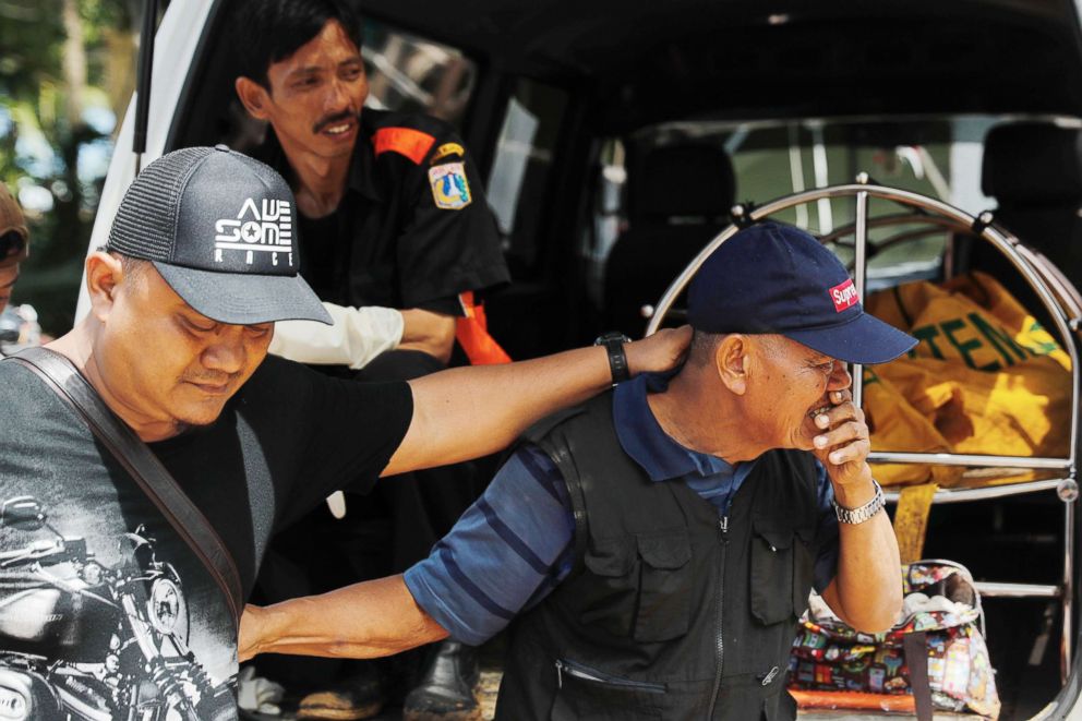 PHOTO: A man reacts after identifying a relative during a rescue operation at the beach front hotel, which was hit by a tsunami in Pandeglang, Banten province, Indonesia, Dec. 24, 2018.