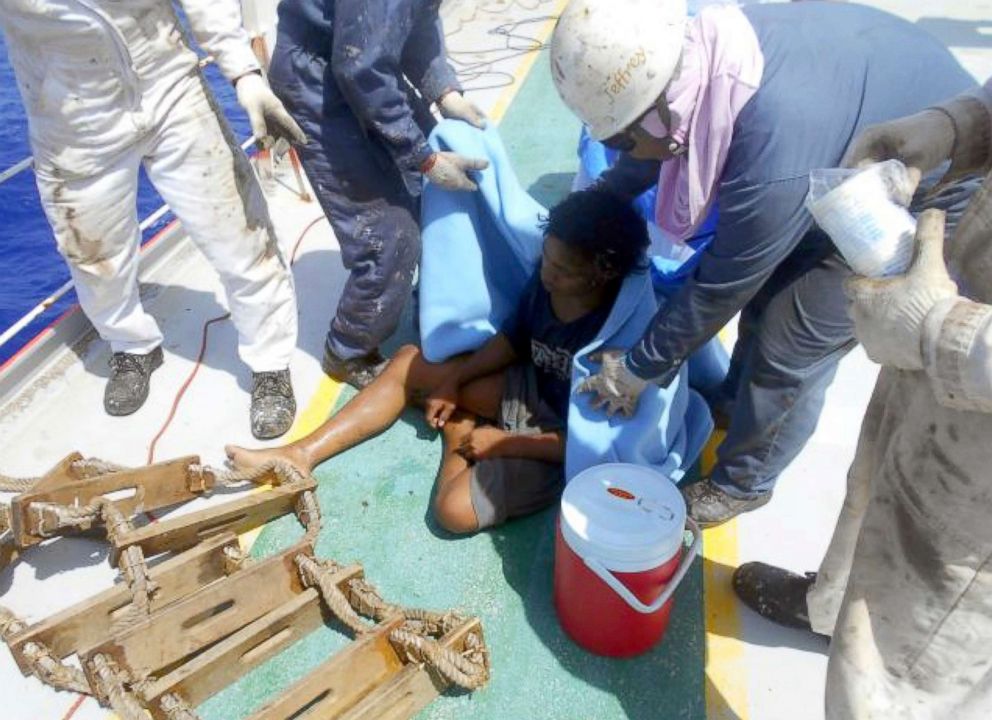 PHOTO: In this undated photo released by Indonesian Consulate General in Osaka, 18-year-old Aldi Novel Adilang sits on the deck of a Panamanian-flagged vessel, MV Arpeggio after being rescued in the waters near Guam.