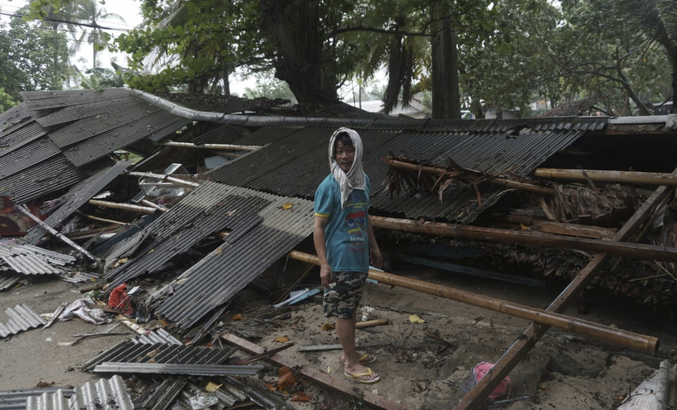 PHOTO: A man inspects his house which was damaged by a tsunami, in Carita, Indonesia, Sunday, Dec. 23, 2018.