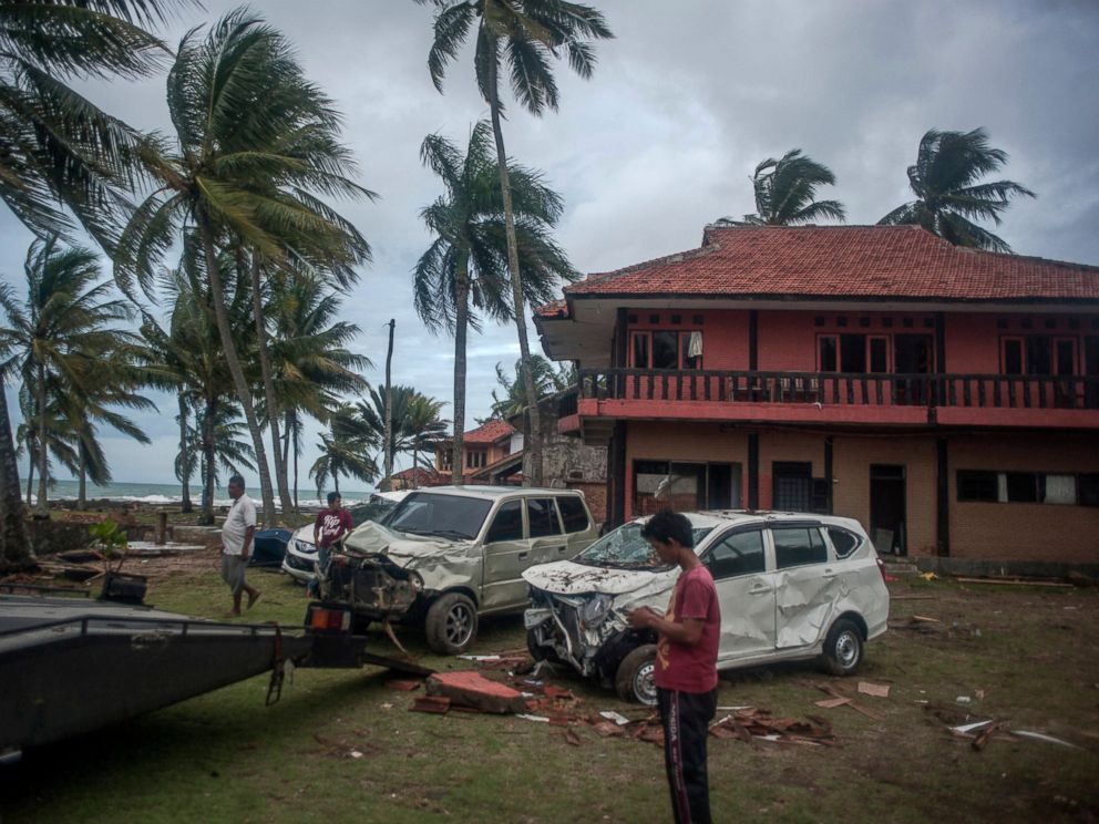 PHOTO: Owners reclaim their damaged cars from a resort affected by Saturdays tsunami in Carita, Indonesia, Tuesday, Dec. 25, 2018.