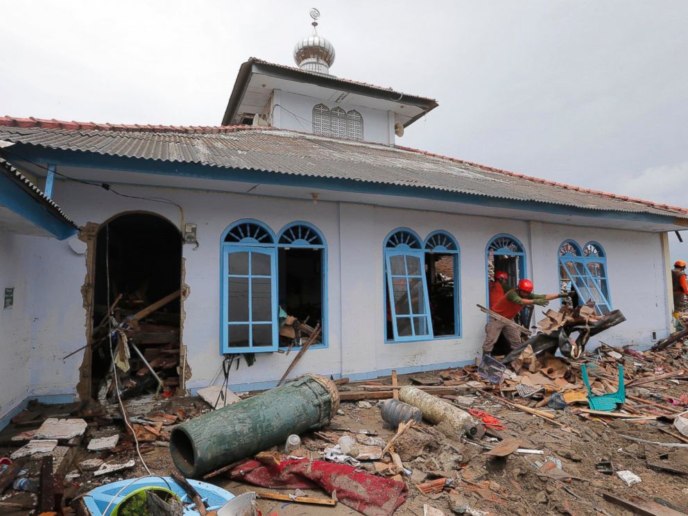 PHOTO: People clean up a mosque following the tsunami in Sumur, Indonesia, Tuesday, Dec. 25, 2018.