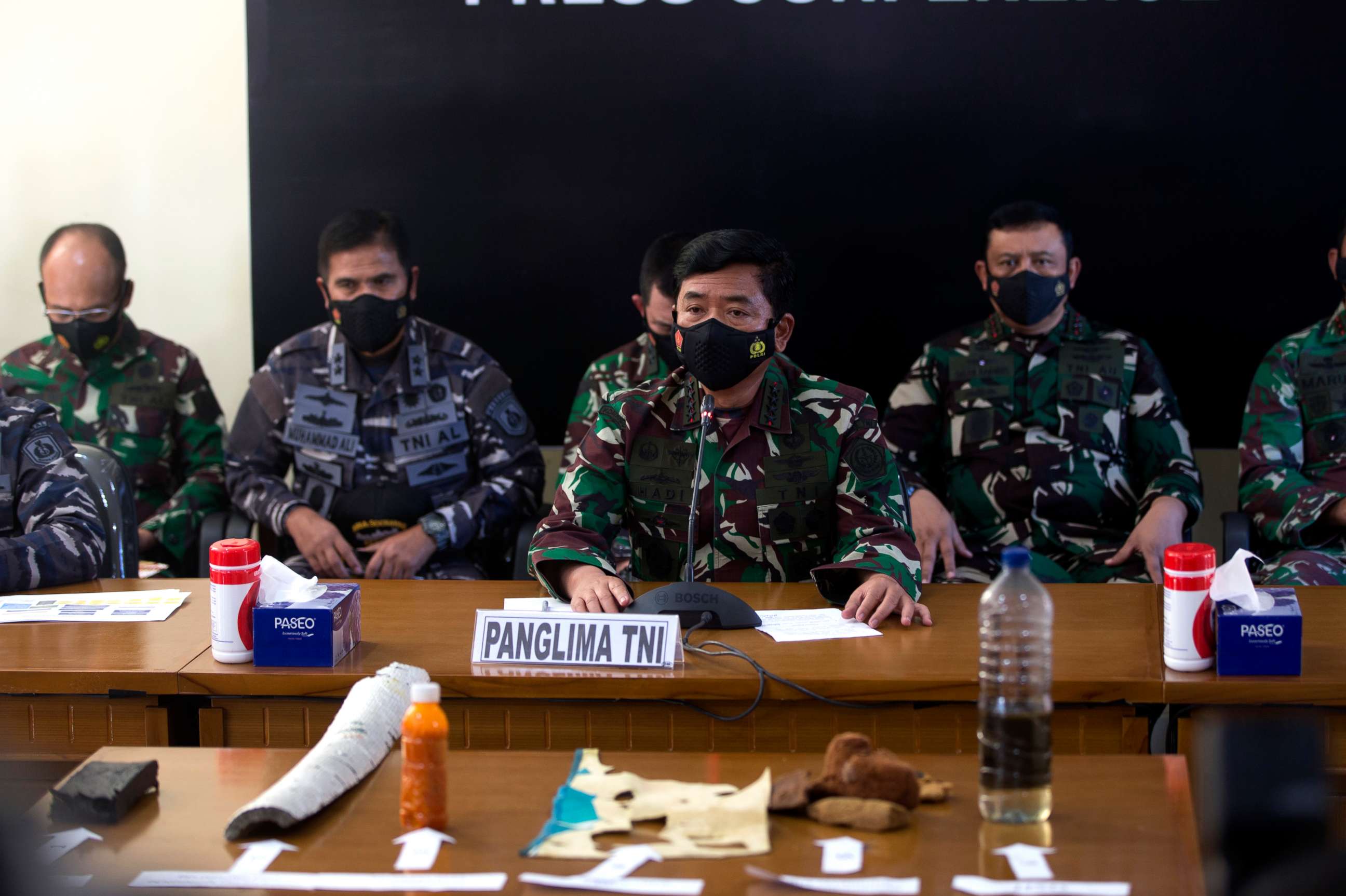 PHOTO: Indonesian Military chief Hadi Tjahjanto, center, talks to media as they display debris found in the waters during a search for The Indonesian Navy submarine KRI Nanggala at Ngurah Rai Military Air Base in Bali, Indonesia on Saturday, April 24.
