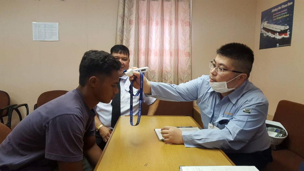 PHOTO: Aldi Novel Adilang, 18, receives a medical exam after being rescued in the waters near Guam by MV Arpeggio, after floating adrift at sea for 7 weeks, in this undated photo.