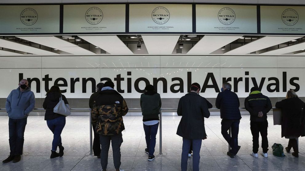 PHOTO: People wait at the international arrivals gate Heathrow Terminal 5, Nov. 28, 2021 in London.