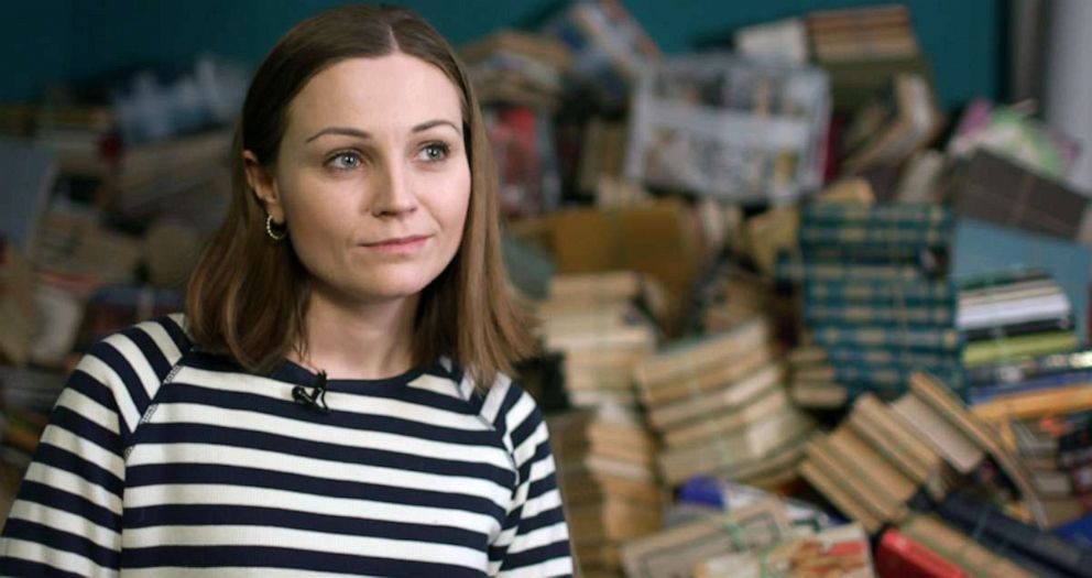 PHOTO: Nadia Kibenko, 32, at the Syayvo bookstore in Kyiv, where Russian language books are taken to be recycled.