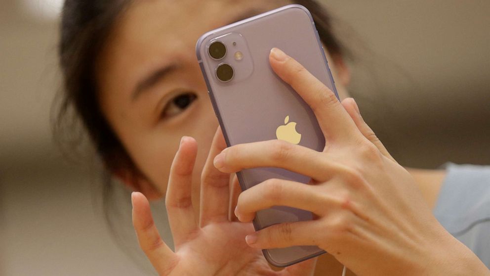 PHOTO: A customer tests Apple's iPhone 11 after it went on sale at the Apple Store in Beijing, China, Sept. 20, 2019.