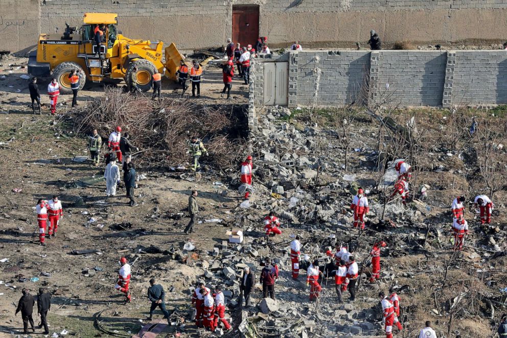 PHOTO: In this Wednesday, Jan. 8, 2020, photo, rescue workers search the scene where a Ukrainian plane crashed in Shahedshahr, southwest of the capital Tehran, Iran. 