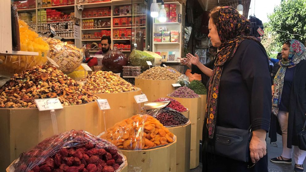 PHOTO: An Iranian woman expresses surprise at the high prices in the Grand Bazaar, in Tehran, Iran, on June 1, 2019.