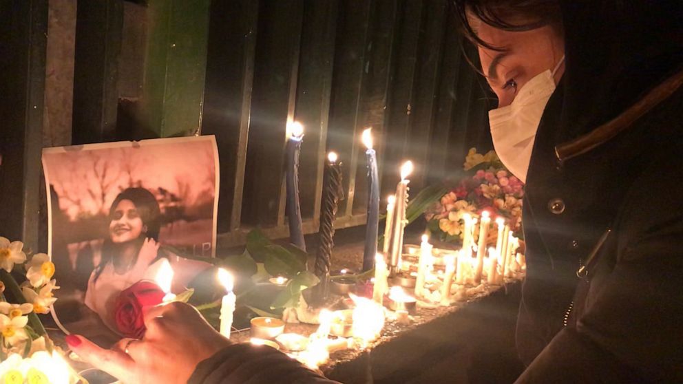 PHOTO: An Iranian woman lights a candle for the victims of the Jan. 8 Ukrainian plane crash, Jan. 11,2020.