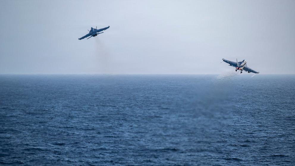 PHOTO: An F/A-18E Super Hornet, attached to Strike Fighter Squadron 151, left, and an EA-18G Growler, attached to Electronic Attack Squadron 133, launch from the flight deck of Nimitz-class aircraft carrier USS Abraham Lincoln, May 9, 2026.