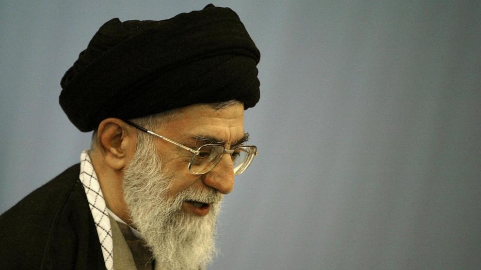PHOTO: Iran's supreme leader Ayatollah Ali Khamenei votes at Imam Khomeini mosque, February 20, 2004 in Tehran.