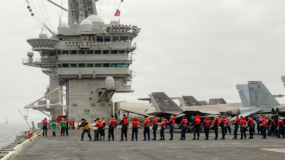 PHOTO: U.S. sailors maintain a phone-and-distance line aboard Nimitz-class aircraft carrier USS George Washington during a fueling-at-sea evolution with fleet replenishment oiler USNS Henry J. Kaiser, Aug. 31, 2026.
