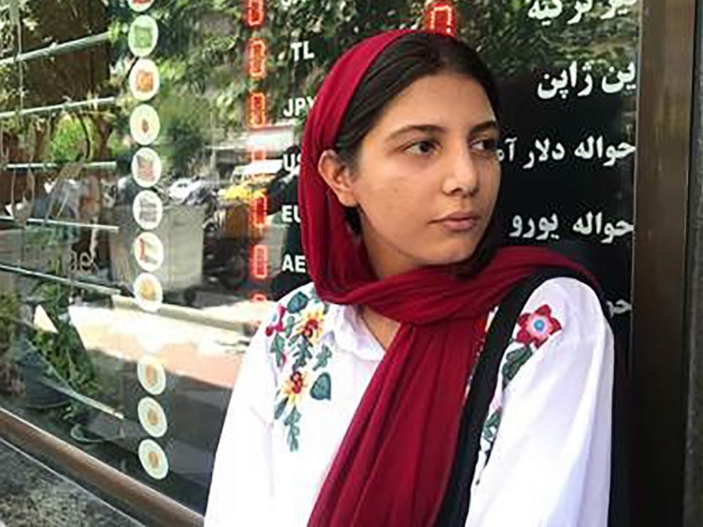 PHOTO: Nafas Anvari, 26, waits at the door of a currency exchange shop, Tehran, Iran, June 15, 2019. 