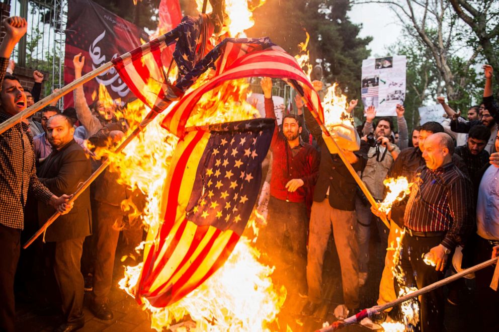 PHOTO: Iranians burn American flags during an anti-U.S. demonstration outside the former U.S. embassy headquarters in Tehran, Iran, on May 9, 2018.