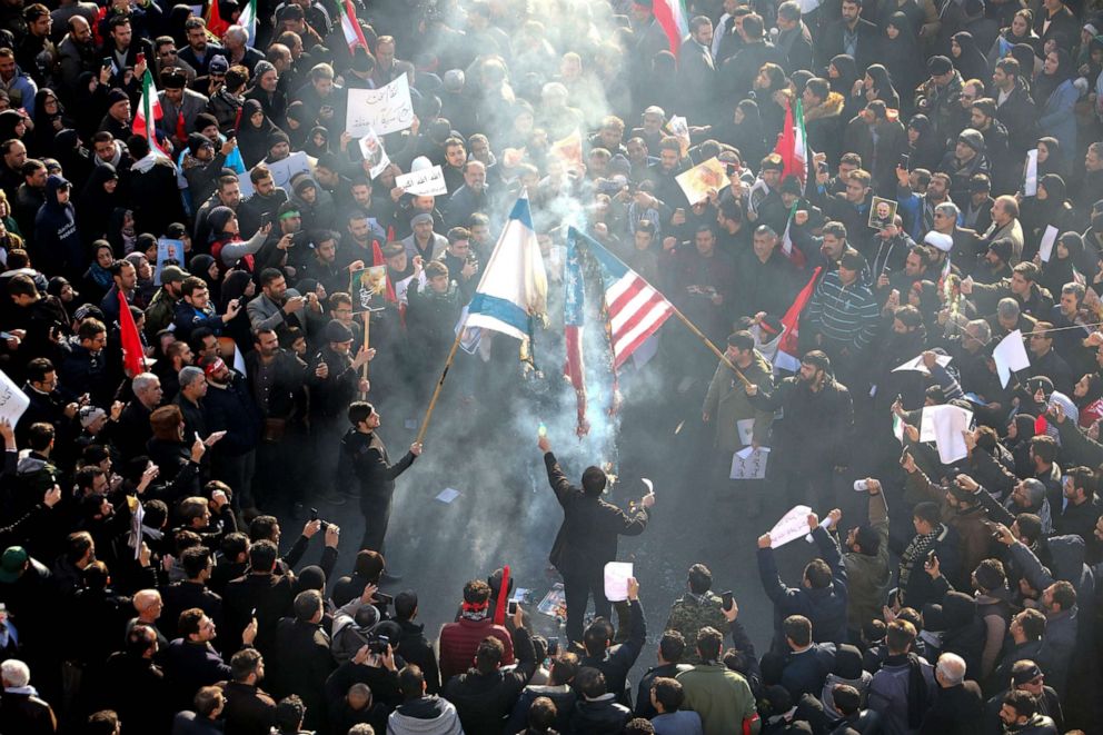PHOTO: Iranians set U.S. and Israeli flags on fire during a funeral procession organised to mourn the slain military commander Qasem Soleimani, Iraqi paramilitary chief Abu Mahdi al-Muhandis and others in the capital Tehran on Jan. 6, 2020.