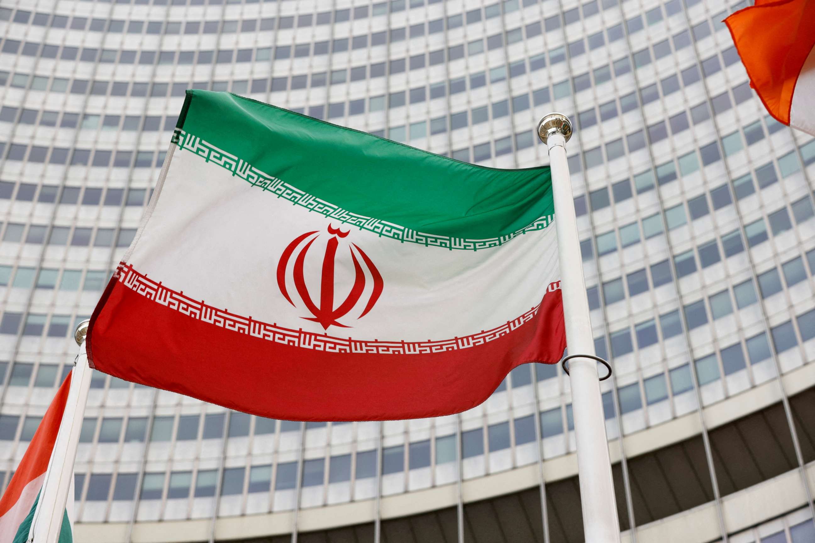 PHOTO: In this May 23, 2021, photo, the Iranian flag waves in front of the International Atomic Energy Agency headquarters in Vienna, Austria.