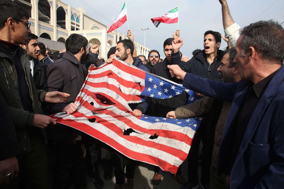 PHOTO: Iranians tear up a U.S. flag during a demonstration in Tehran on Jan. 3, 2020 following the killing of Iranian Revolutionary Guards Major General Qassem Soleimani, in a U.S. strike on his convoy at Baghdad international airport.